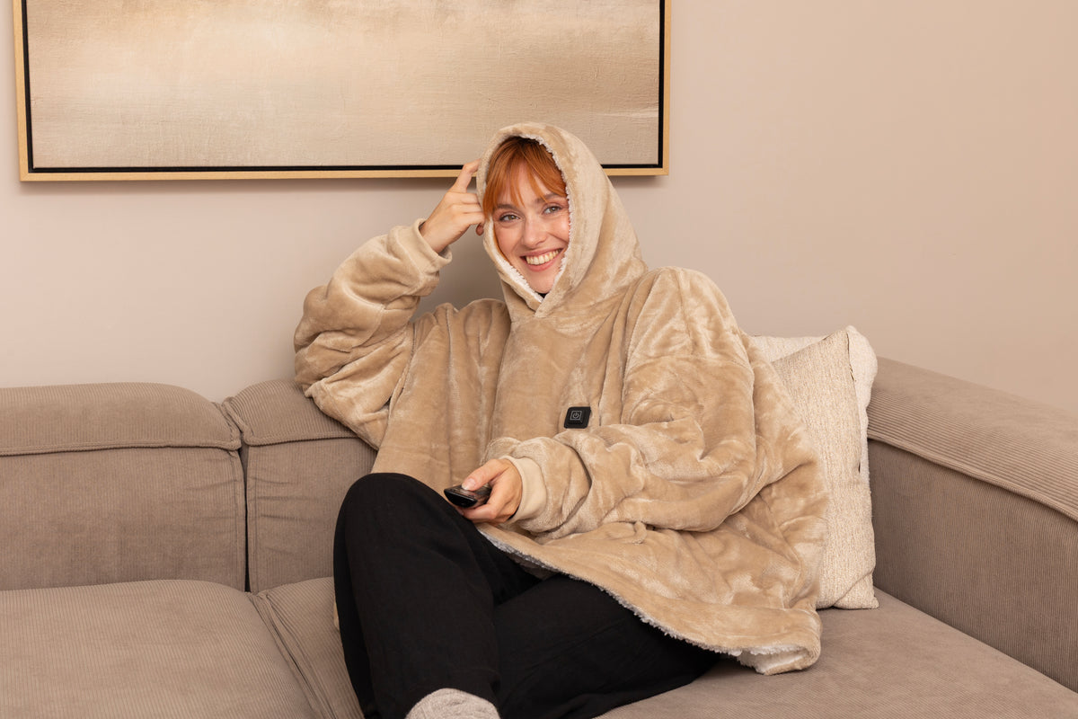 Verwarmde snuggle hoodie voor op de bank