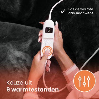 Handbediening van een elektrische warmtedeken met keuze uit 9 warmtestanden – pas de warmte eenvoudig aan naar wens.